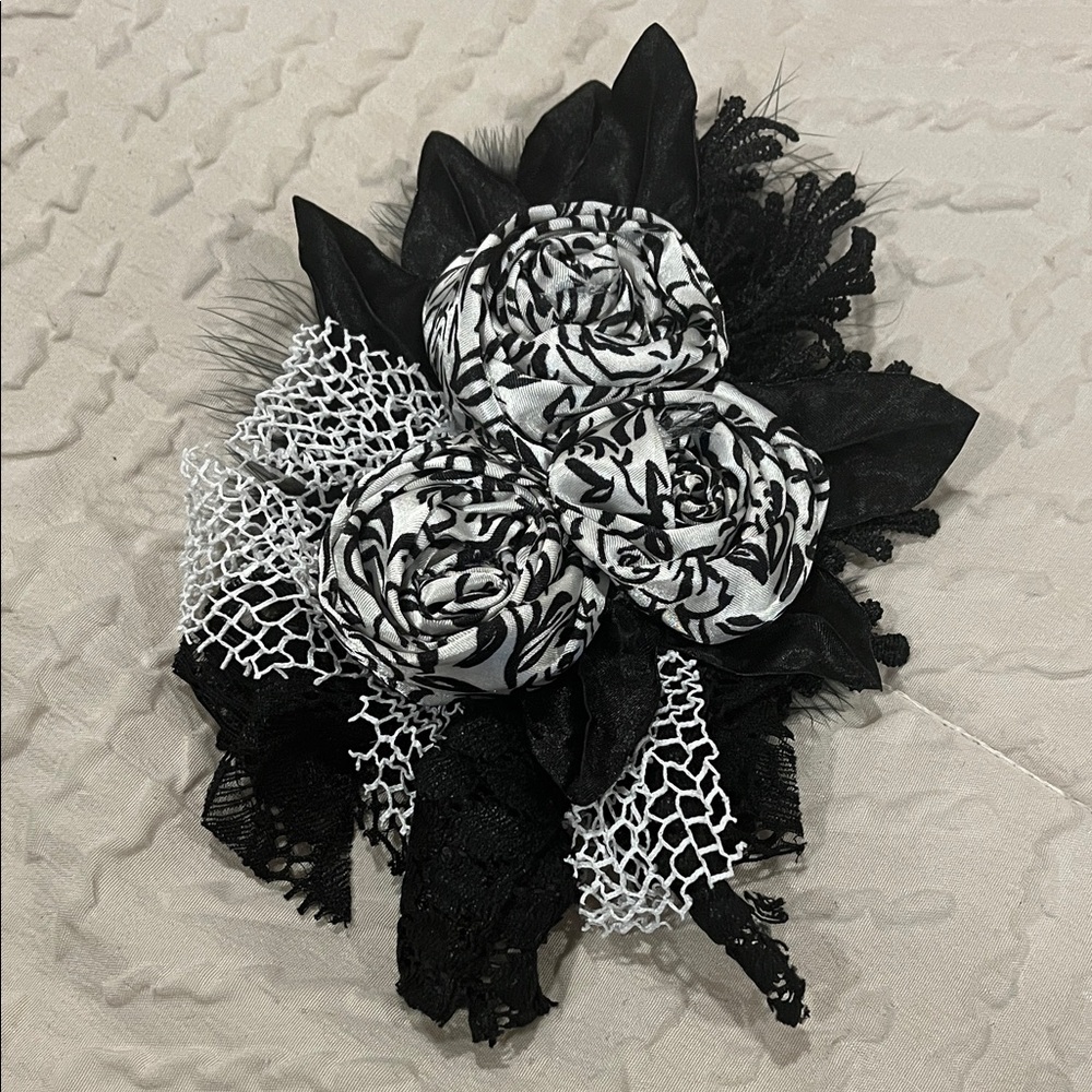 Elegant Black and White Floral Brooch